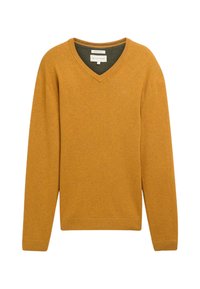 Jersey de pico en color mostaza, hecho de una tela suave. Presenta mangas largas, puños y dobladillo acanalados, y un forro interior verde.