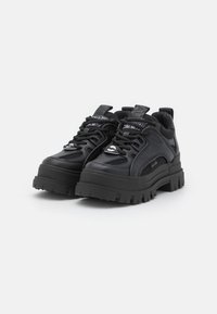 Black athletic shoes with a chunky sole, synthetic leather and mesh upper, prominent laces, and textured rubber outsole for grip.