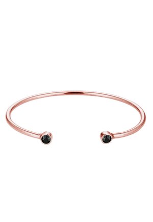 Roségoldene Armcuff mit einem eleganten, offenen Design. Verfügt über zwei runde schwarze Steine, die an jedem Ende eingefasst sind. Glatte, polierte Oberfläche.