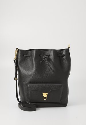 Black leather bucket bag with a textured finish, drawstring closure, front pocket, and gold-tone hardware accents. Adjustable strap included.