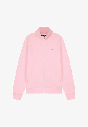 Veste zippée rose clair avec col montant, deux poches latérales, poignets côtelés, et petit logo brodé sur la poitrine.