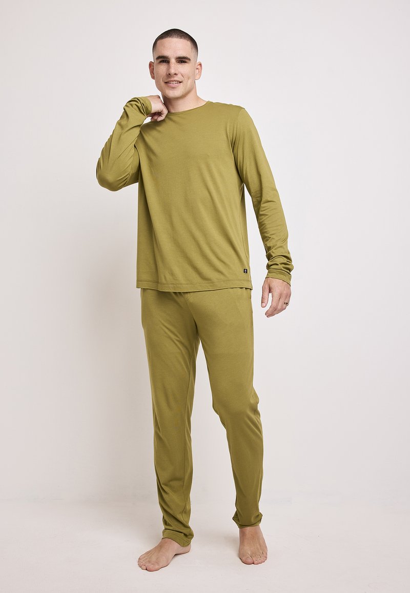 Olive green long-sleeve top with matching pants, made of soft material. The top features a crew neckline and the pants have a relaxed fit.
