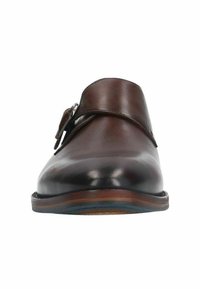 Brown leather slip-on shoe with a smooth finish, rounded toe, a side buckle detail, and a contrasting wooden sole.