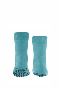 Türkise Crew-Socken mit geripptem Bund und strukturierten Grip-Mustern an der Sohle. Hergestellt aus einem weichen, elastischen Stoff für zusätzlichen Komfort.