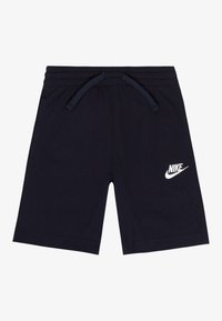 Shorts sportivi blu navy con cintura elastica, cordoncino e logo Nike bianco nella parte inferiore sinistra. Materiale in cotone morbido.