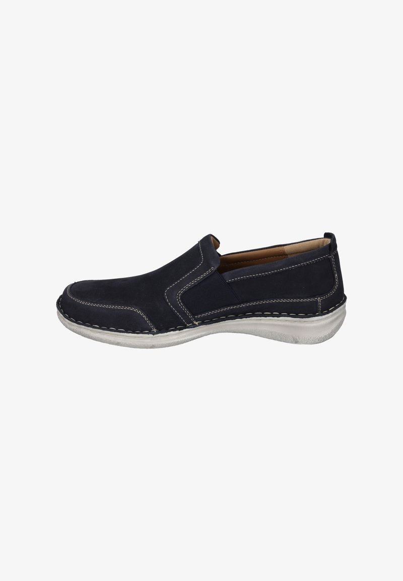 Zapatos tipo slip-on de ante en color marino con costuras blancas en contraste, suela texturizada y paneles laterales elásticos para fácil colocación.