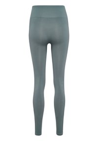 Leggings a vita alta di colore teal tenue, realizzati in materiale elasticizzato con una texture liscia e dettagli di cucitura discreti lungo le gambe.