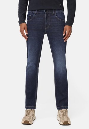 Donkerblauwe denim jeans met een recht gesneden pijp, voorzien van vijf zakken, contrasterende stiksels en een knopenfly sluiting.