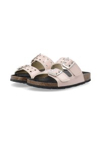 Roze sandaaltjes met twee verstelbarebanden met zilveren gespen. Gelaagd voetbed op een kurken zool en rubberen buitenzool. Stijlvolle oogjesdetails.