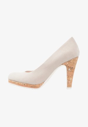 Beige suede high heel shoe with a rounded toe, featuring a cork accent on the platform and heel, and a smooth white sole.