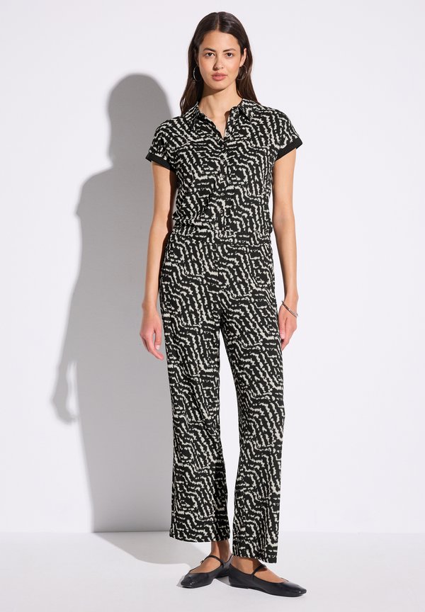 GEMUSTERTER - Jumpsuit - schwarz