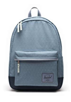 Light blue Herschel backpack with diamond pattern, front zip pocket, white zipper pulls, and dark bottom panel on white background.
