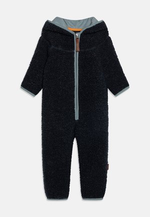 Marineblå fleece heldragt med hætte, fuld lynlås og grå detaljer. Blød struktur, lange ærmer og forstærket syning ved sømmene.