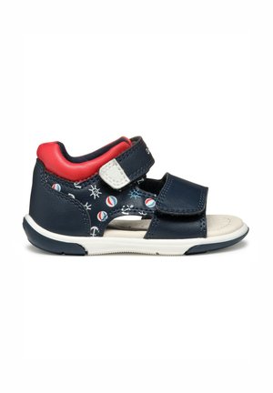 Mørkeblå og rød sandaler til småbørn med hvide anker- og boldmønstre, åben tå og justerbare velcroremme.