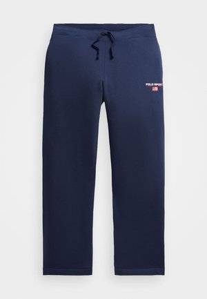 Pantaloni de sport bleumarin, dintr-un amestec moale de bumbac, cu talie elastică, șnur ajustabil și logo-ul "POLO SPORT" pe față.