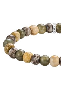 Beaded bracelet featuring round stones in earthy tones of green, brown, and yellow, accented with a silver "THOM" charm.