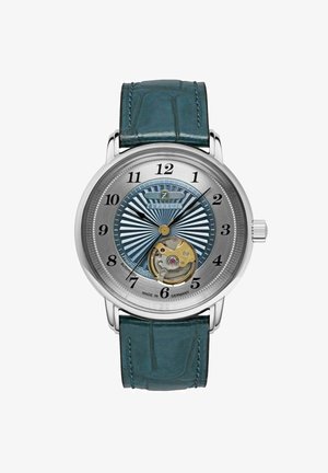 Silberne Armbanduhr mit einem türkisfarbenen Krokodillederarmband, blauem Sonnenschliff-Zifferblatt, schwarzen Stundenmarkierungen und einem sichtbaren automatischen Uhrwerk bei 6 Uhr.