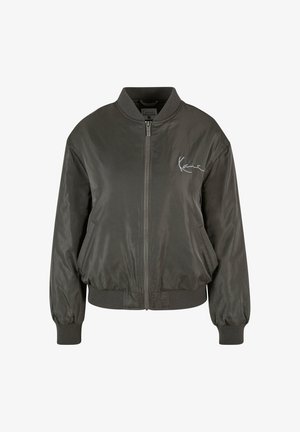 Tamsiai pilka bomber tipo striukė su užtrauktuku priekyje, furnizuota spalvotu apykakle ir rankogaliais, šoniniais kišenėmis bei subtilia logotipu krūtinėje. Lygus paviršius.