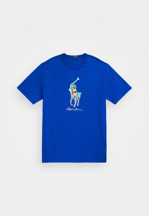 Blå bomuld T-shirt med et farverigt polo-spiller motiv og "Ralph Lauren" signatur. Rund hals og korte ærmer. Glat tekstur.