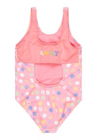 Roze badpak met Roxy-logo. Het heeft een ronde hals en uitsnijdingen, versierd met kleurrijke cirkelvormige en gestreepte accenten.