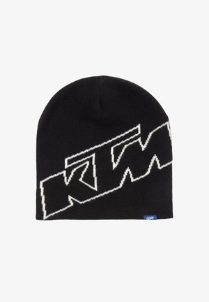 Berretto lavorato a maglia nero con un grande logo "KTM" bianco. Tessuto morbido con una parte superiore arrotondata e un'etichetta blu sul lato.
