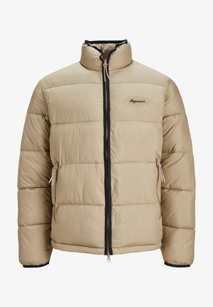 Beige puffer jacket with a high collar, black zipper, and side pockets. It features horizontal stitching and a logo on the chest.