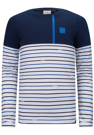 Chemise à manches longues avec le haut bleu marine, le bas blanc orné de rayures horizontales noires et bleues, et le petit texte "Retour" dispersé sur les rayures.