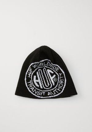 Zwarte gebreide beanie met een groot wit grafisch ontwerp in het midden met "HUF" en omringende tekst. Zachte textuur, aansluitende vorm.
