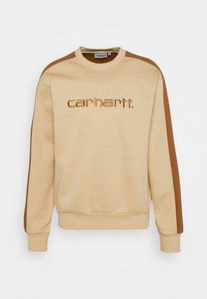 Beige Sweatshirt mit braunen Streifen entlang der Ärmel und "carhartt." in Braun auf der Brust gestickt, mit gerippten Bündchen und Saum.