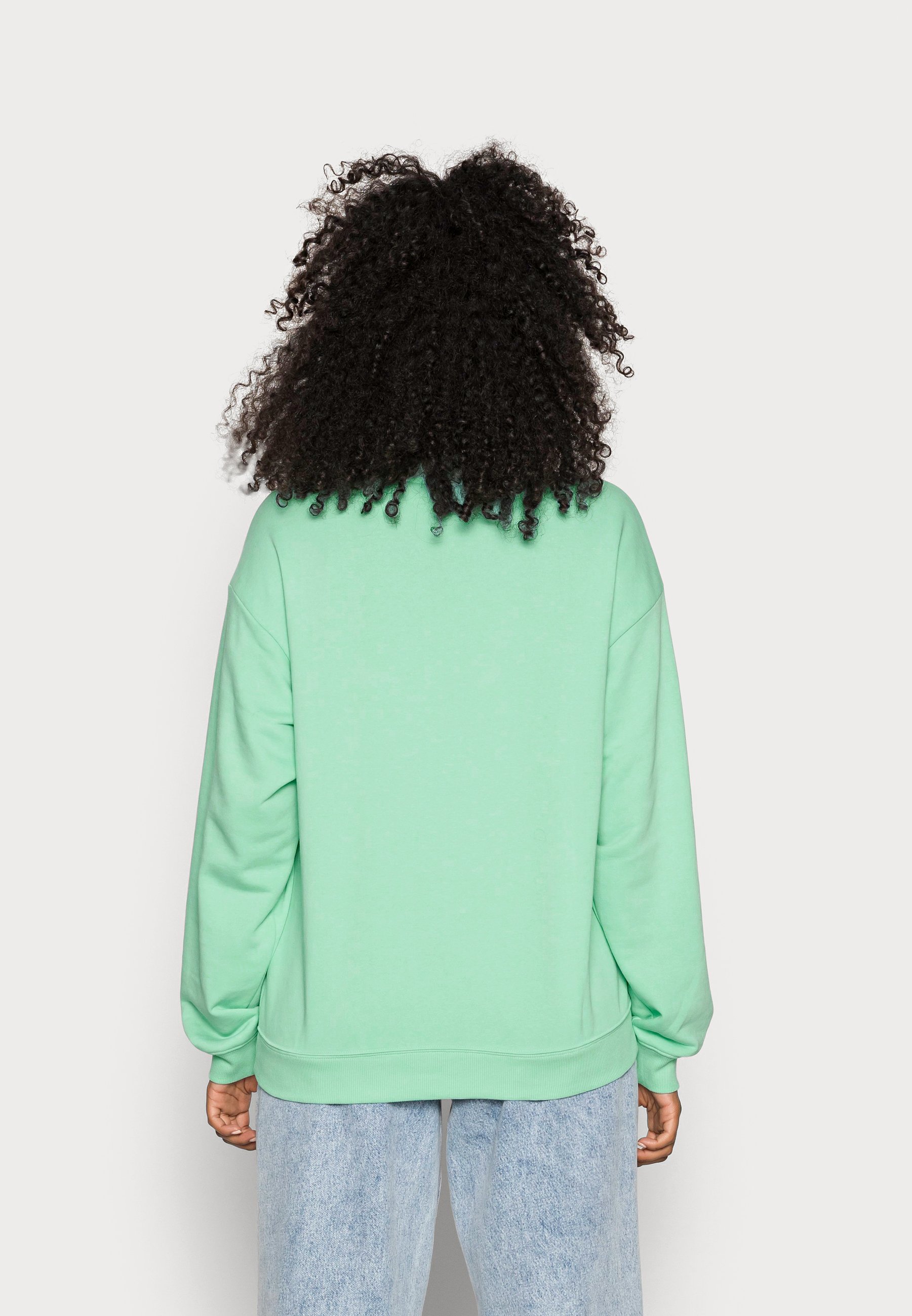 light green sweatshirt