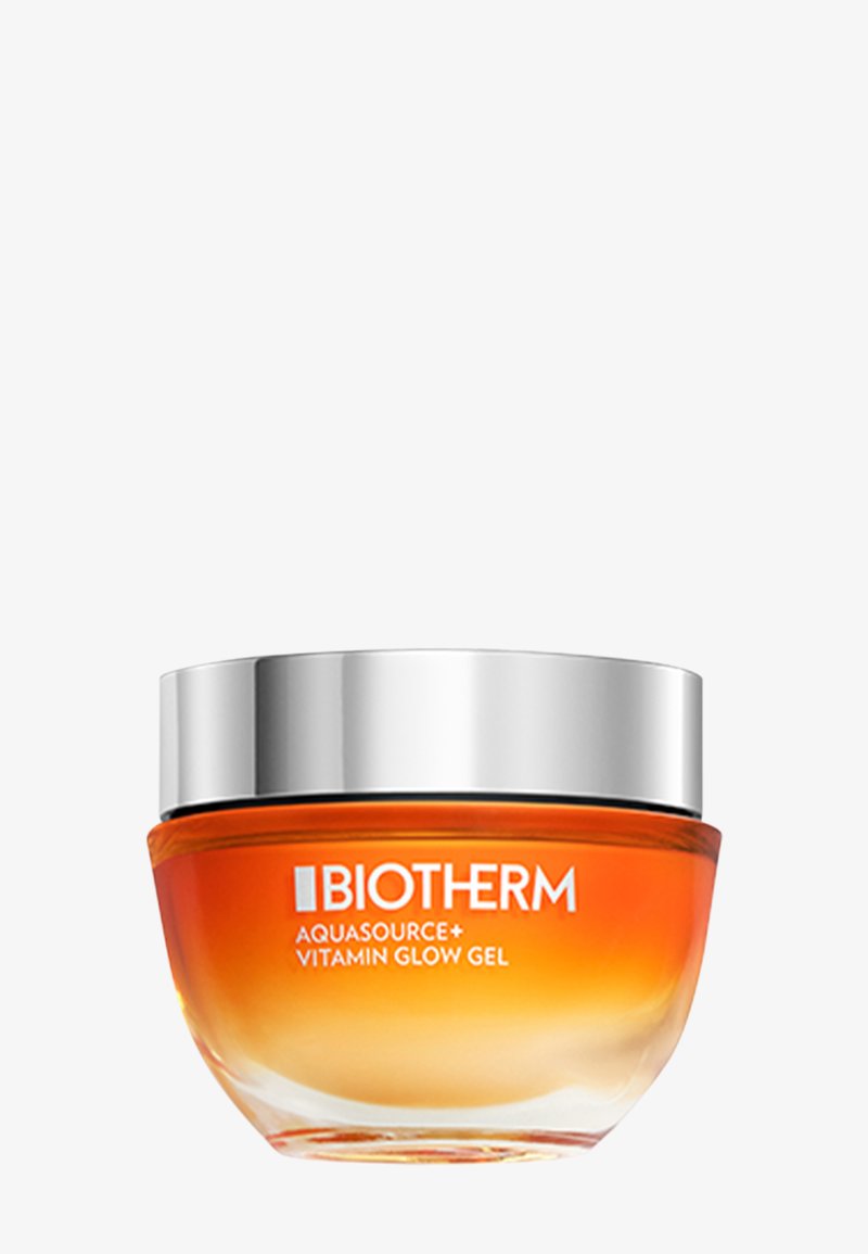Żel Biotherm Aquasource+ Vitamin Glow w okrągłym szklanym słoiku z gradientową pomarańczową podstawą i srebrną nakrętką. Gładka, przezroczysta tekstura.