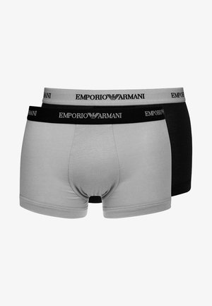 Deux paires de boxers hommes, une grise et une noire, dotées de ceintures élastiques avec la marque "Emporio Armani" en lettres blanches.