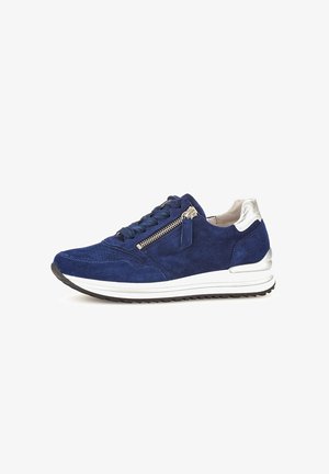 Navy blue suede sneaker with a textured surface, white midsole, silver accent at heel, and a side zipper detail.