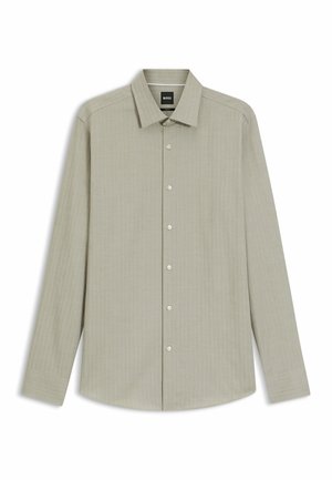 Lange mouwen, licht olijfgroene blouse van textuurstof, met een button-down kraag en zes knopen aan de voorkant. Eenvoudig ontwerp zonder patronen.