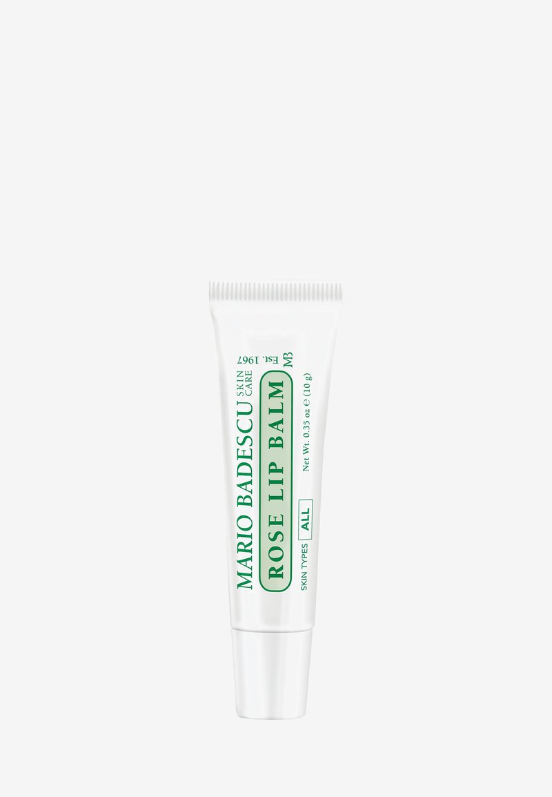 White plastic tube with green text, labeled "Mario Badescu Rose Lip Balm", 0.35 oz. Features a ribbed cap and a smooth surface.