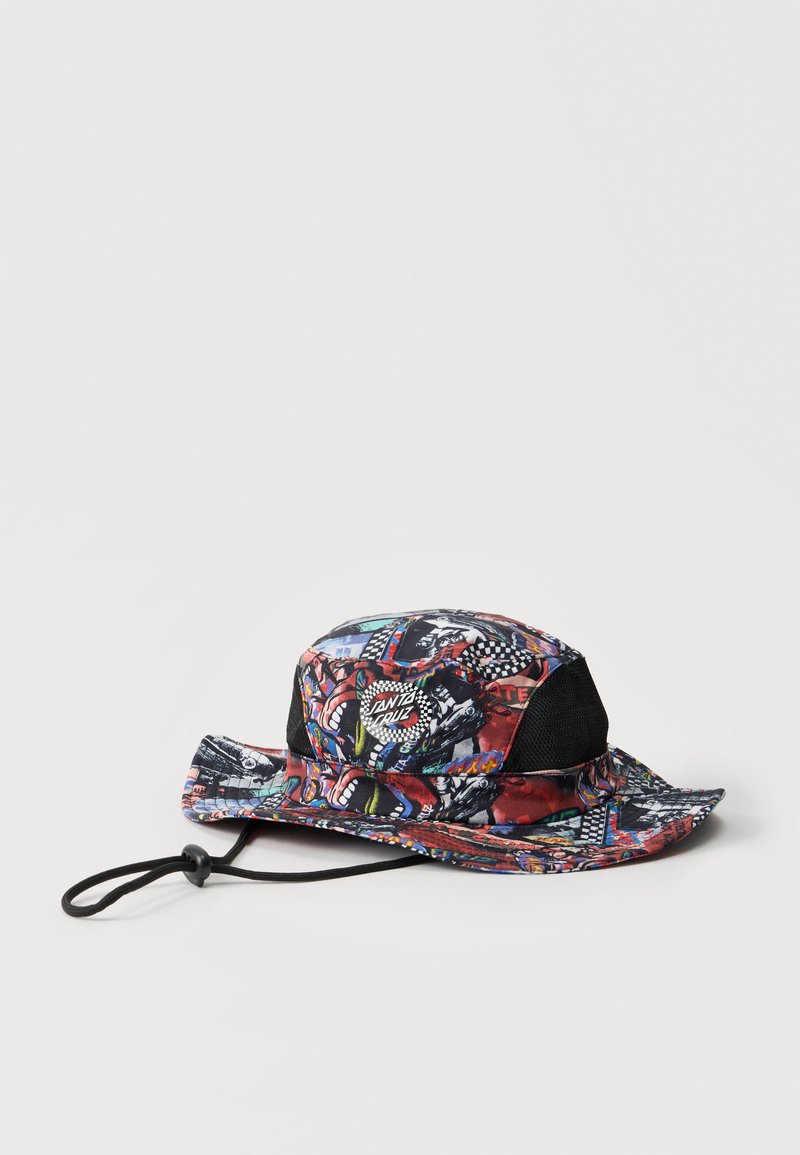 Καπέλο τύπου bucket με πολύχρωμα, γραφικά σχέδια σκέιτμπορντινγκ, πλευρικά πάνελ από δίχτυ και ρυθμιζόμενο λουρί στο πηγούνι με μαύρο κλείδωμα.