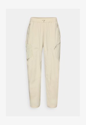 Light beige cargo pants with an elastic waistband, zippered pockets, and panel details. Made from a smooth, lightweight fabric.