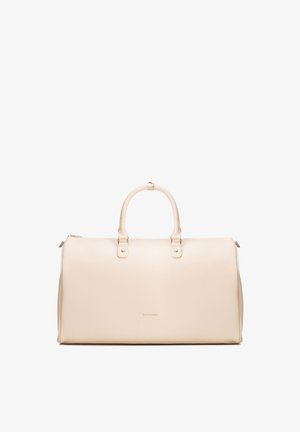 Beżowa torba sportowa ze skóry z dwoma uchwytami, zamkiem błyskawicznym i małą marką "Wittchen" na środku przodu.