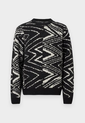 Sort og hvid strikket sweater med abstrakte zigzag- og geometriske mønstre, rund hals, lange ærmer samt ribbede manchetter og kant.