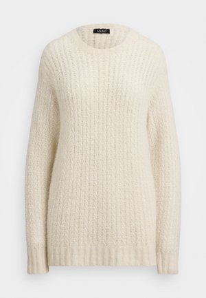 Cream-colored sweater made of a textured, knit material. Features a round neckline and ribbed cuffs. Patterns include a zigzag design.