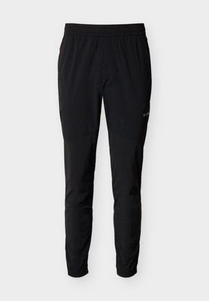 Pantaloni da esterno neri con vita elastica, gambe affusolate e polsini elastici, con un logo del marchio discreto sulla coscia destra.