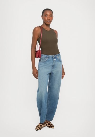 Olive tank top, blue wide-leg jeans, leopard print shoes, and small red crossbody bag. Simple design with smooth textures and casual style.
