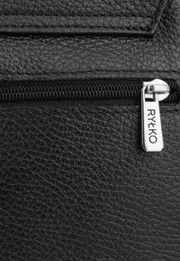 Black textured leather material with a zipper detail; silver hardware features the text "RYŁKO." Smooth finish and functional design.