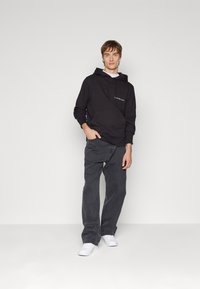 Calvin Klein Jeans INSTITUTIONAL HOODIE - Sweatshirt - black