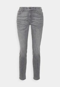 Jeans de mezclilla gris con un ajuste slim, cinco bolsillos y un cierre frontal de botón. La tela presenta un ligero desgastado y una textura suave.
