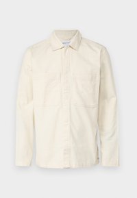 Light beige long-sleeve shirt made of a cotton blend, featuring a collar, front button closure, and two chest pockets. Smooth texture.