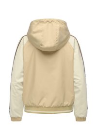 Veste à capuche beige et crème à manches longues, bande brune le long des manches, poignets élastiques et taille côtelée avec deux bandes crème.