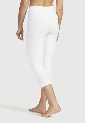 Weißes Baumwollleggings mit einem elastischen Bund, taillierter Passform und verkürzter Länge, zeigt eine glatte Textur und ein einfaches Design.