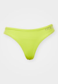 Neon zelena bikini spodnjica, izdelana iz gladkega_materiala. Ima nizko pasovno zasnovo z nabranim vzorcem in logotipom "GUESS" okrašenim z rhinestones.