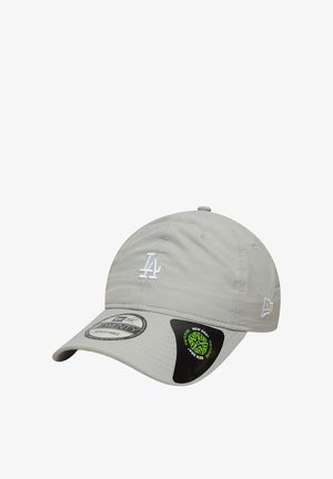 Light gray adjustable baseball cap with white LA logo on front and New Era logo on side, featuring branded stickers on the curved brim.